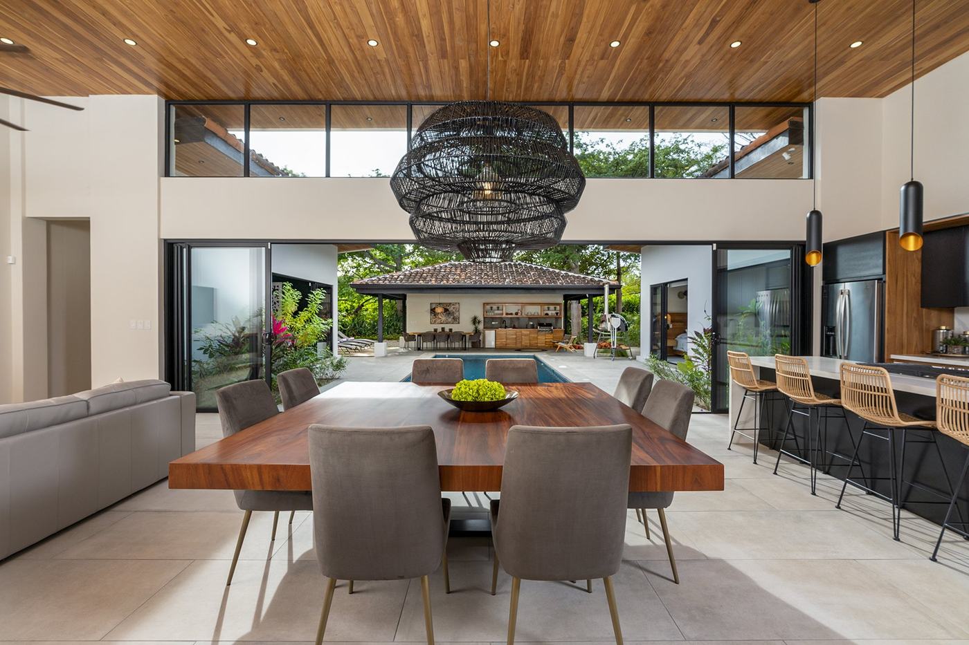 Mary’s interior design at Reserva de Golf, opening from the dining room to a courtyard pool