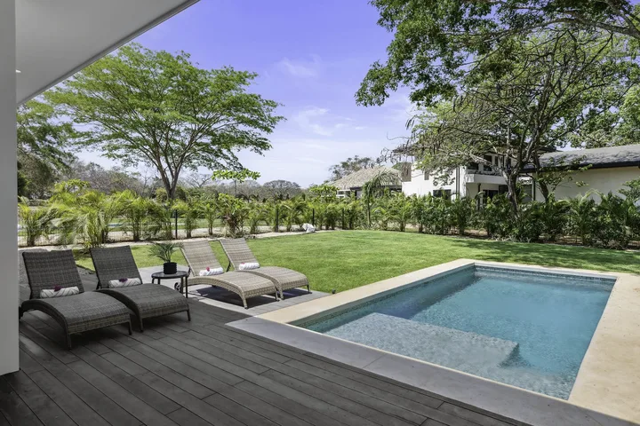 Private pool, timber deck and garden at an Entroterra home